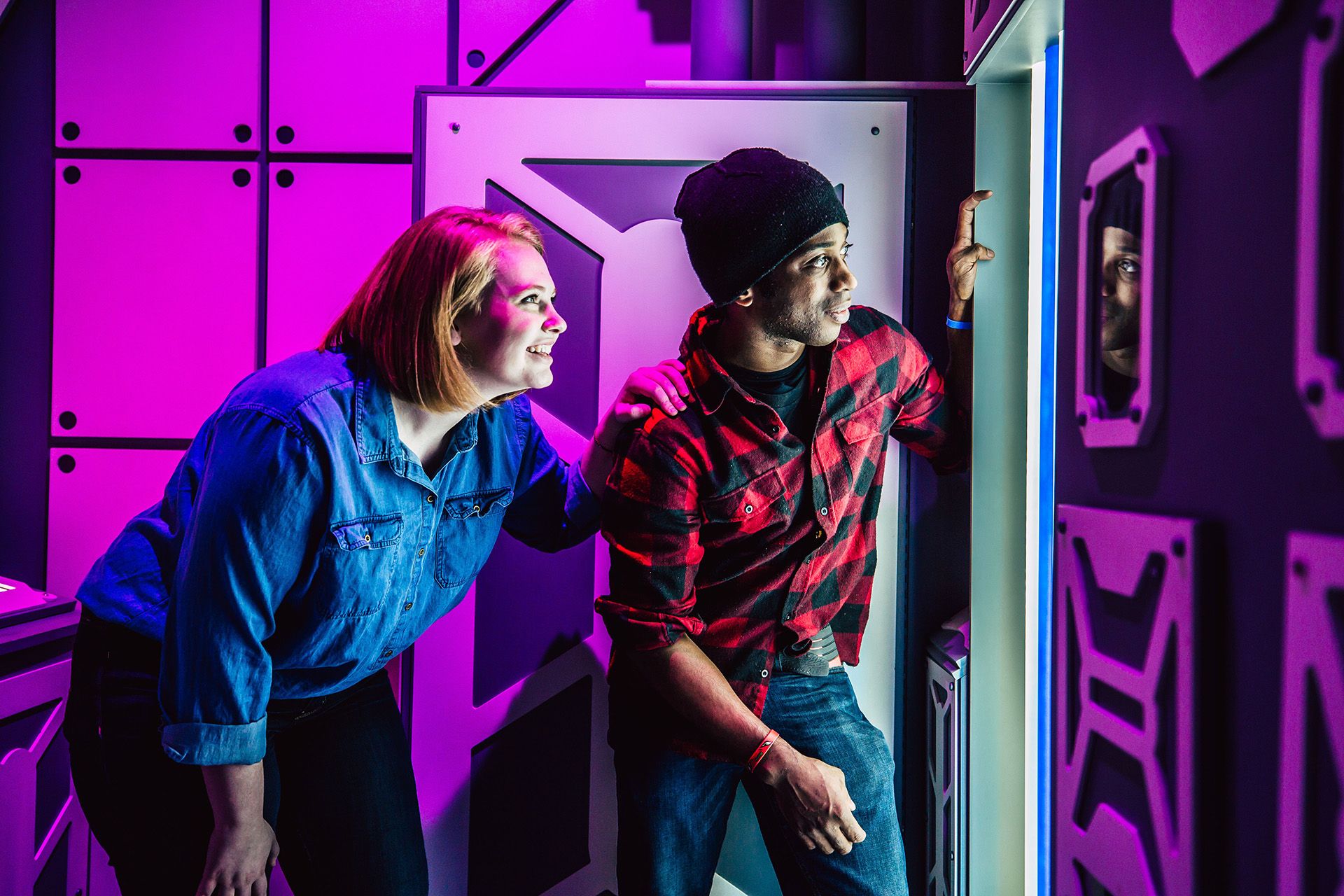 Man and Woman playing Escape Room