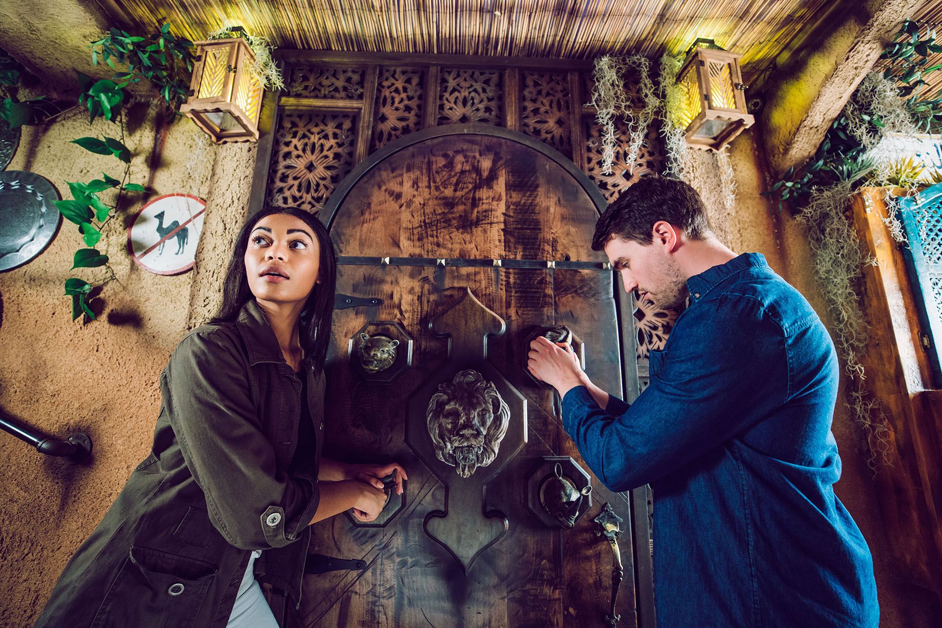 two people working to solve an escape room