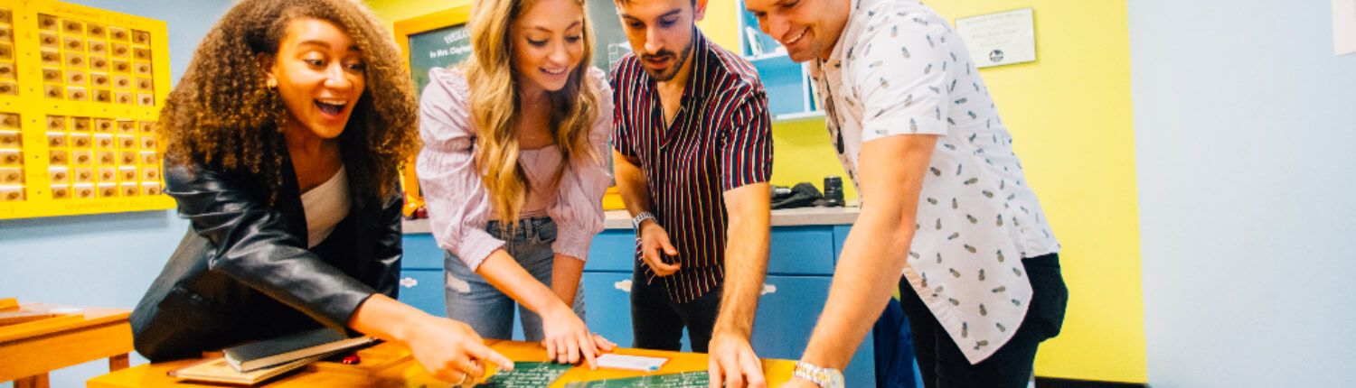 people playing the playground escape room at The Escape Game New Orleans