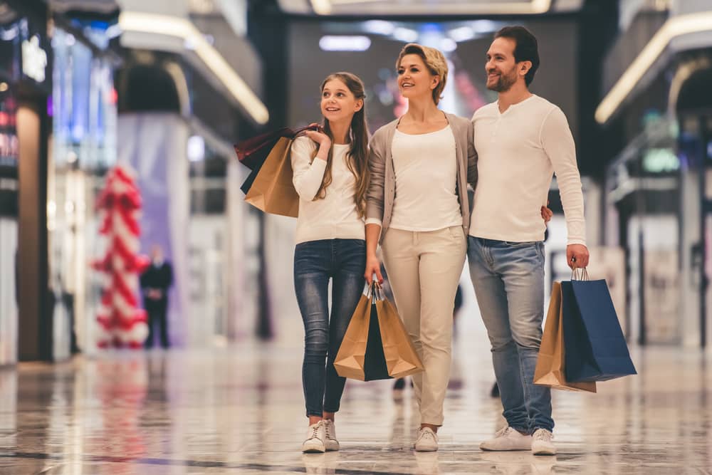 Teen and parents at shopping mall
