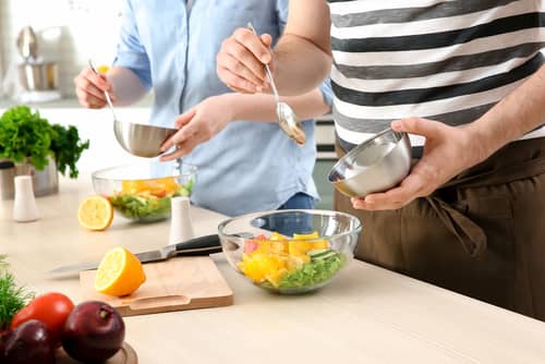 a couple cooking 