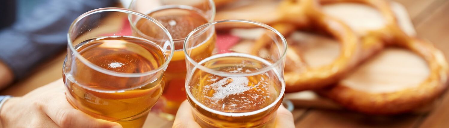 people cheering with beers