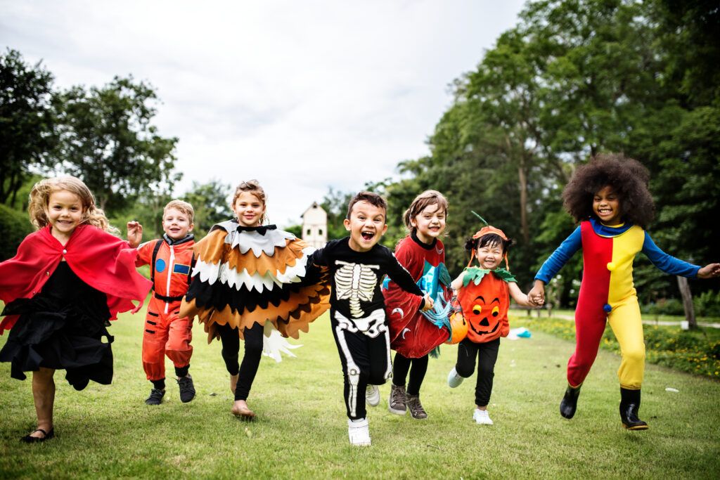 happy kids in halloween costumes