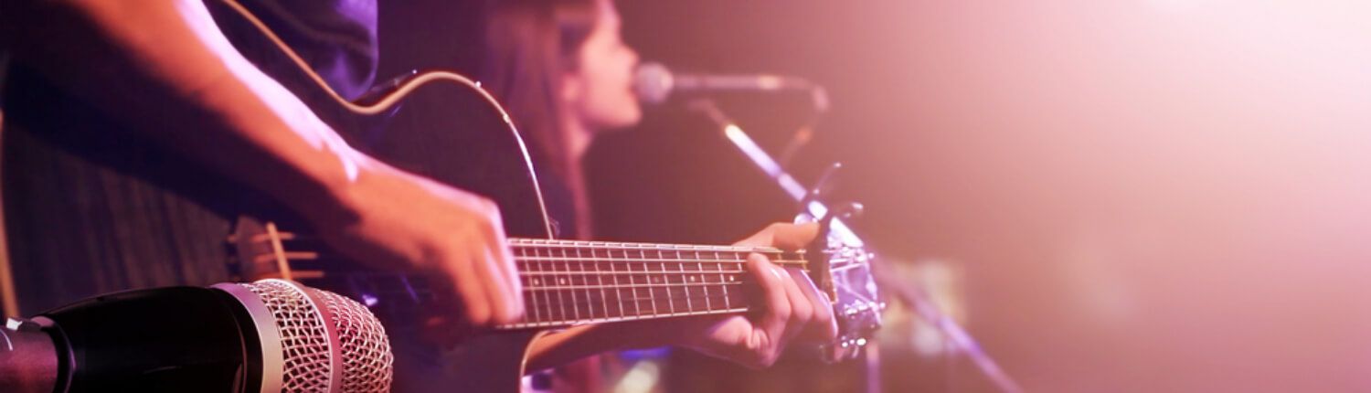 guy playing a guitar