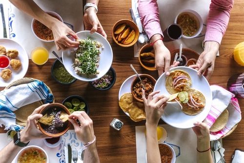 people sharing mexican food