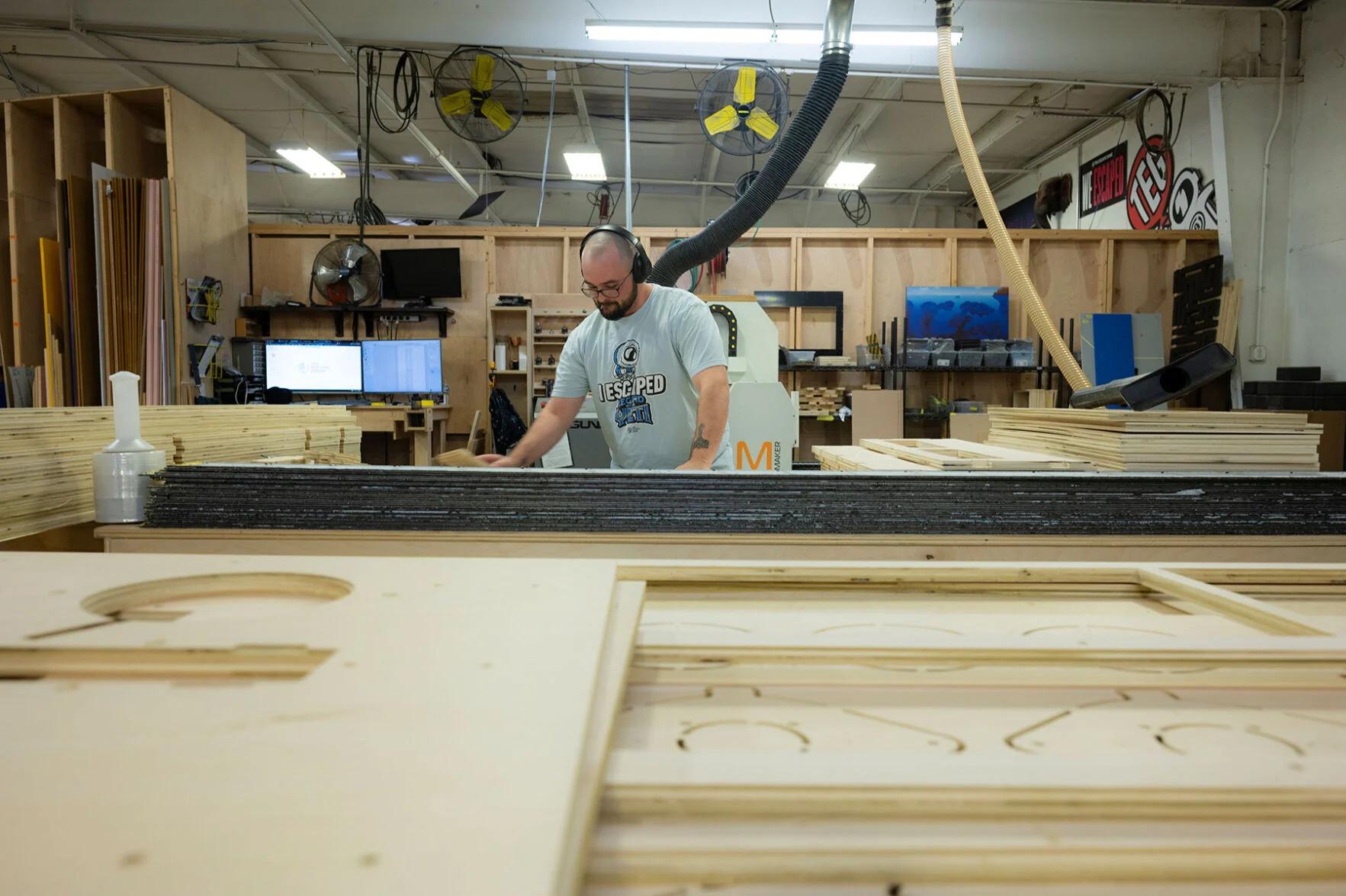 Worker using CNC machine