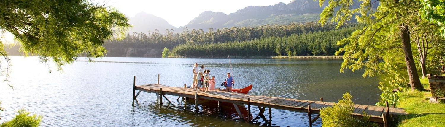 people on a dock on a lake